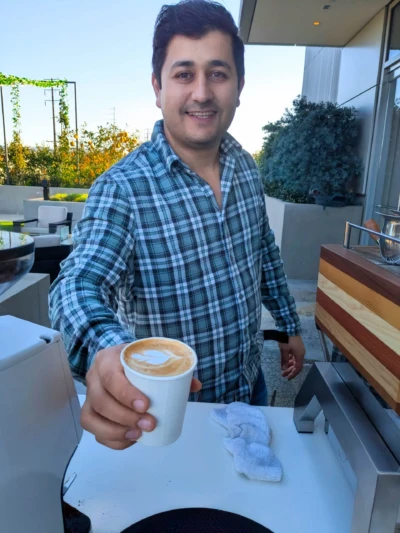 A barista presenting art latte at Culver City A barista presenting art latte at Culver City